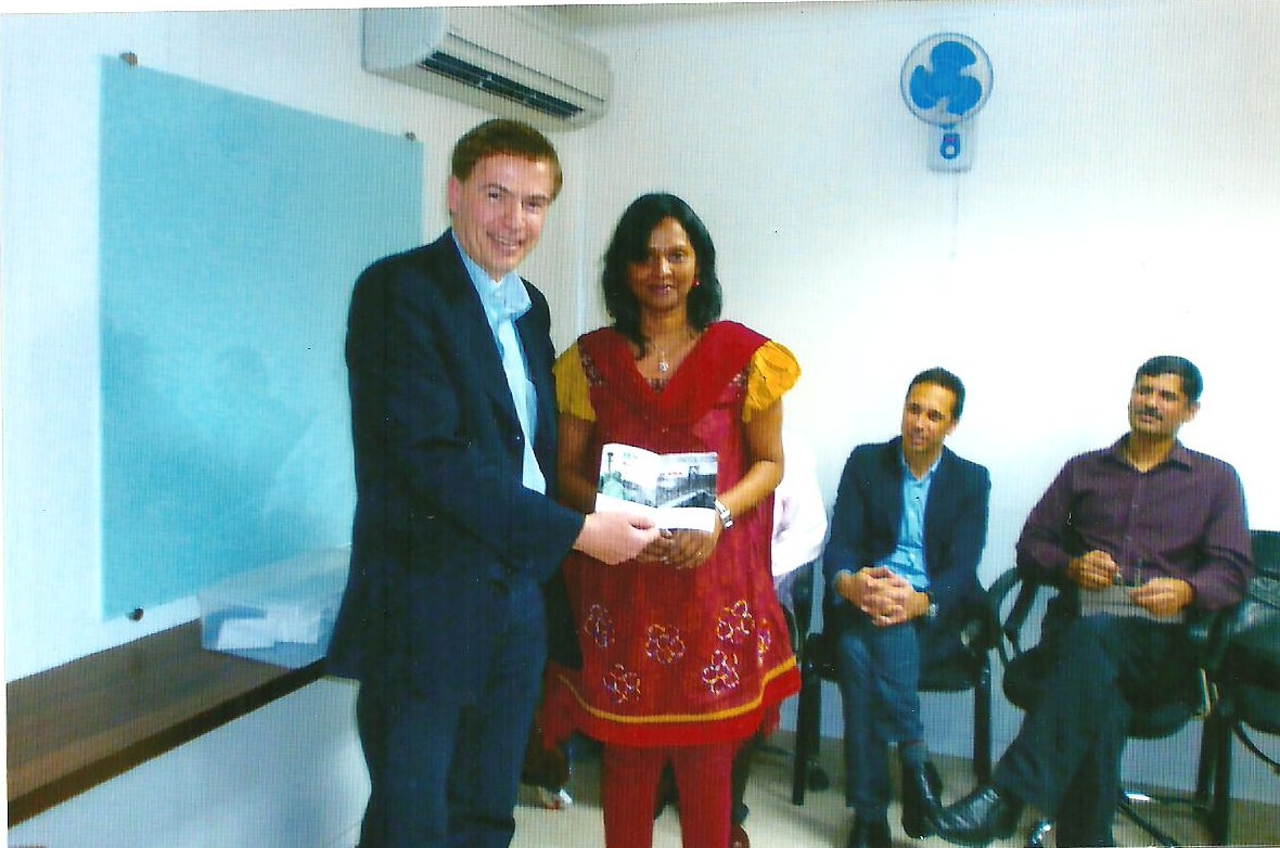 Dr. Sridevi receiving an award from Dr. Peter Nagi